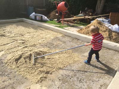 Jax working hard spreading sand